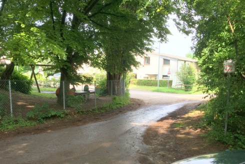The car in the lower right is about where the old gentleman was. the trees have sure grown up in the years since I was there, but the fencepost I bounced off would have been where the one just about dead center in the photo is. The ditch is just behind the fence to the right of center in the background. The building in the background was a field.