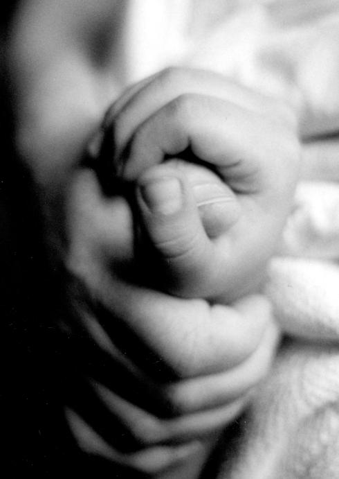 Dad holding Michael's hand